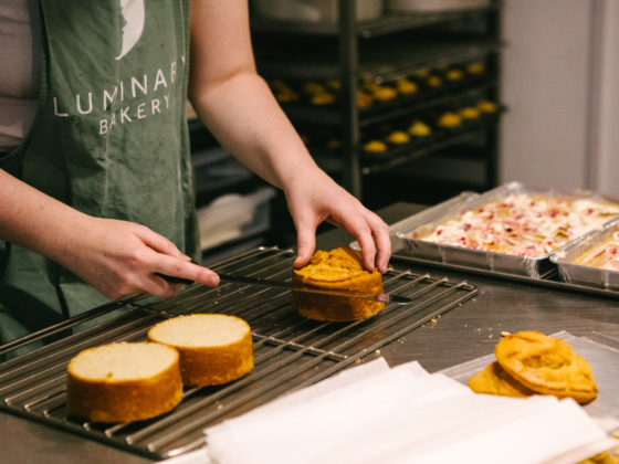 Person decorating cakes