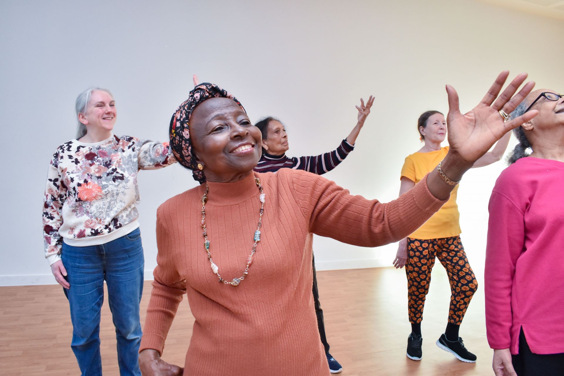 Older ladies dancing together