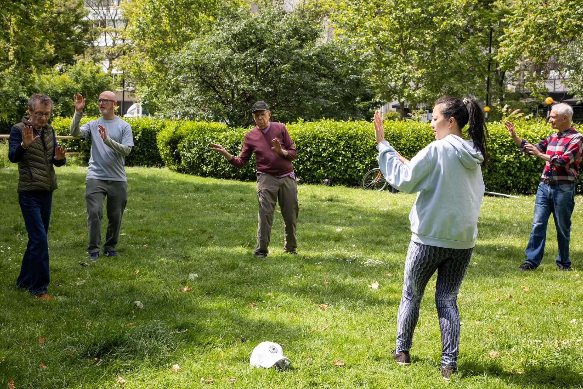 People doing group sport in a green space